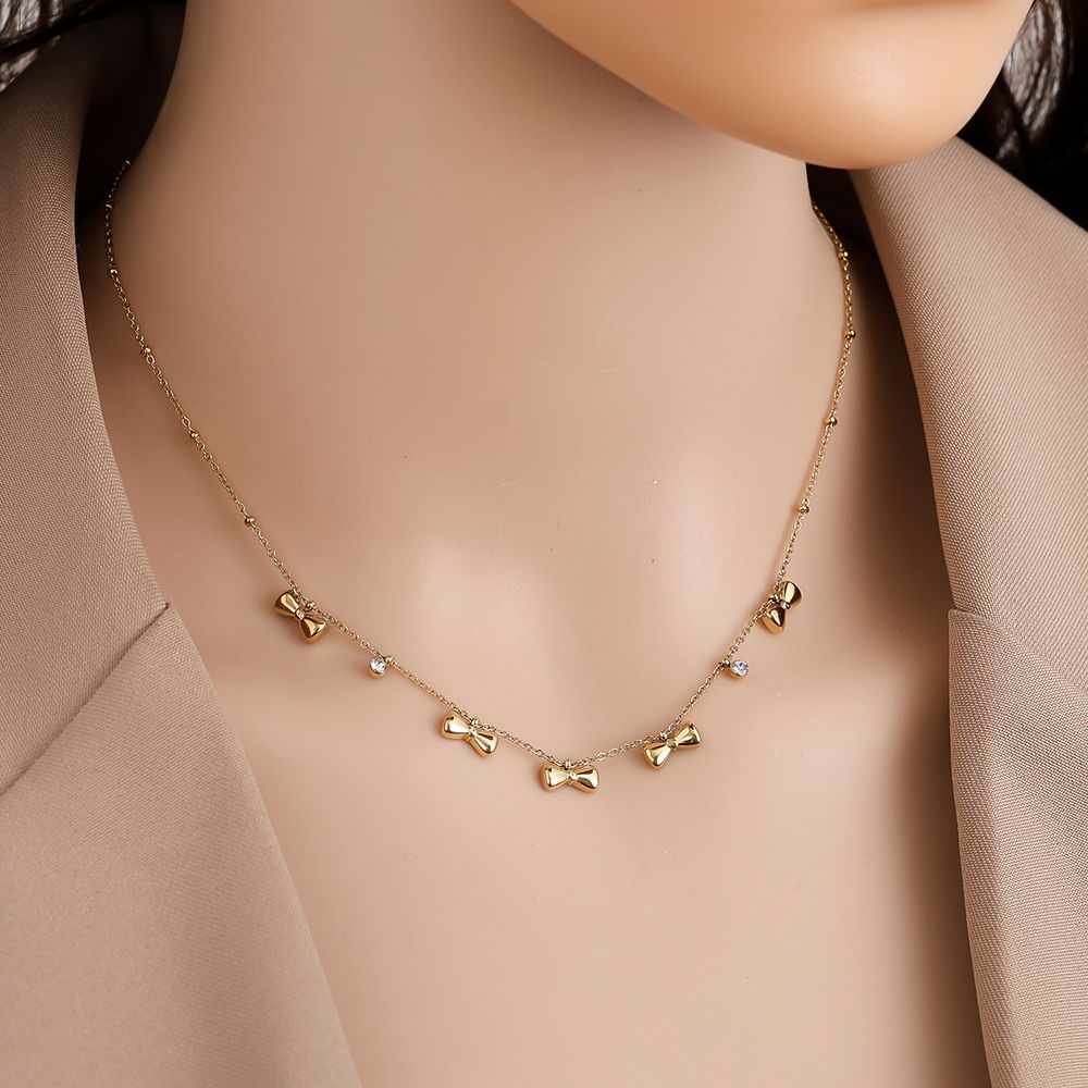 Minimalistische ketting Shiny Bow| Jewellery by Marie gouden ketting strikjes met diamant